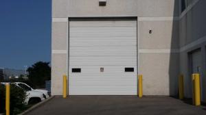 China Electric Overhead 6500mm Polyurethane Fire Rated Sectional Door on sale