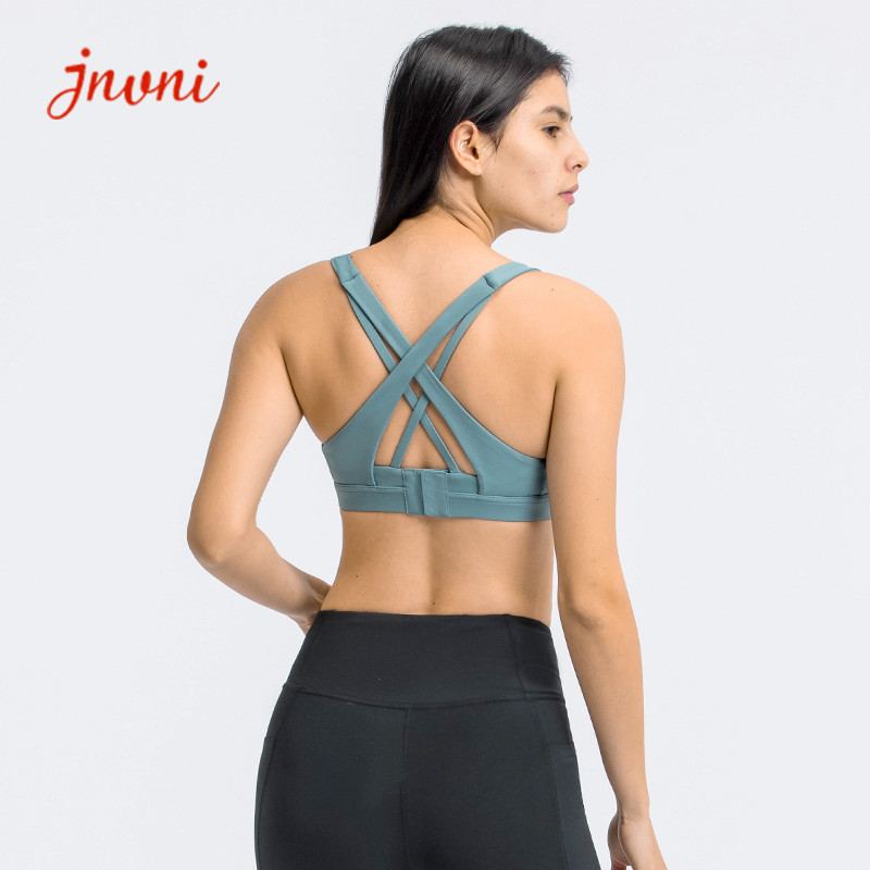 China Strappy Sports Bra For Women Sexy Crisscross Back Adjustble Button Yoga Running Athletic Gym Workout Fitness Tops on sale