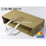 China Kraft Custom Paper Shopping Bags , Plastic Handle Eyelet Brown Craft Tea Gift Bags for sale