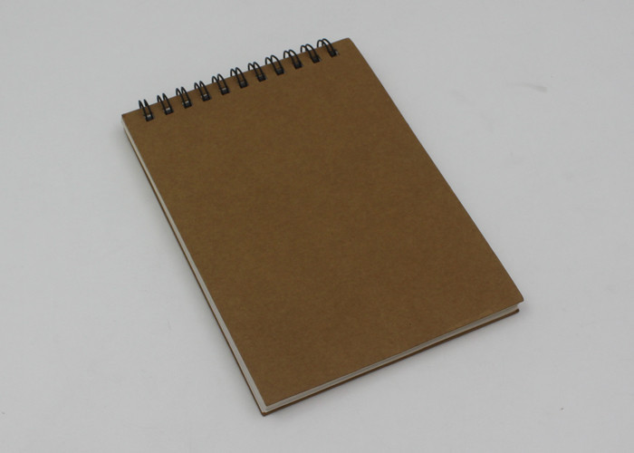 Cheap Eco - Friendly Pocket Kraft Paper Notebook With Line Printing Inside / Spiral Notepad for sale