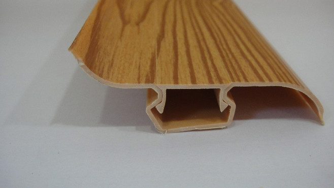 China Dust Proof 80% PVC Skirting Board Covers Profile With Wood Grain Pattern on sale