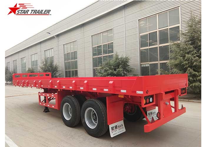 Cheap 2 Axles 30ft 30Ton Flatbed Semi Trailer For Transporting Construction Machinery for sale