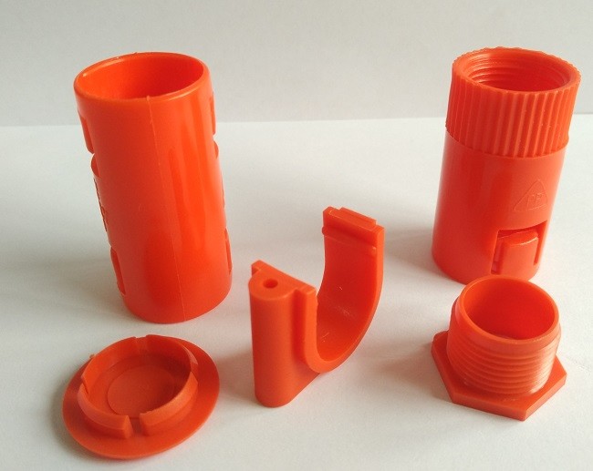 China Orange ABS Plastic Injection Molded Parts Multi Cavity For Vending Machine on sale
