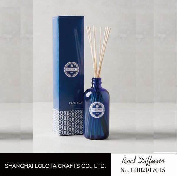 Cheap transparent blue color reed diffuser with natural stick and pattern folding box for sale